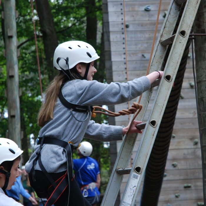 Girl climbing a ladder