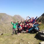 School group celebrating walking up Snowdonia