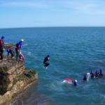 jumping from the juassic coast during coasteering session
