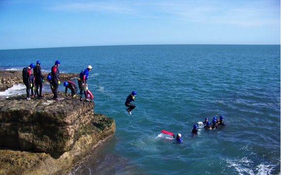 jumping from the juassic coast during coasteering session
