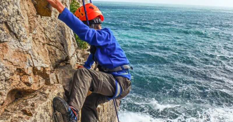 climbing cliff with sea views in dorset