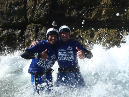 Two coasteering instructors enjoying the sea