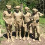 School group thoroughly enjoying the mud run!