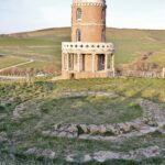 Clavell Tower and original footing overlooking Kimmeridge Bay