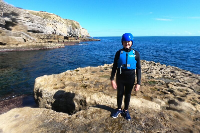 family group coasteering at dancing ledge