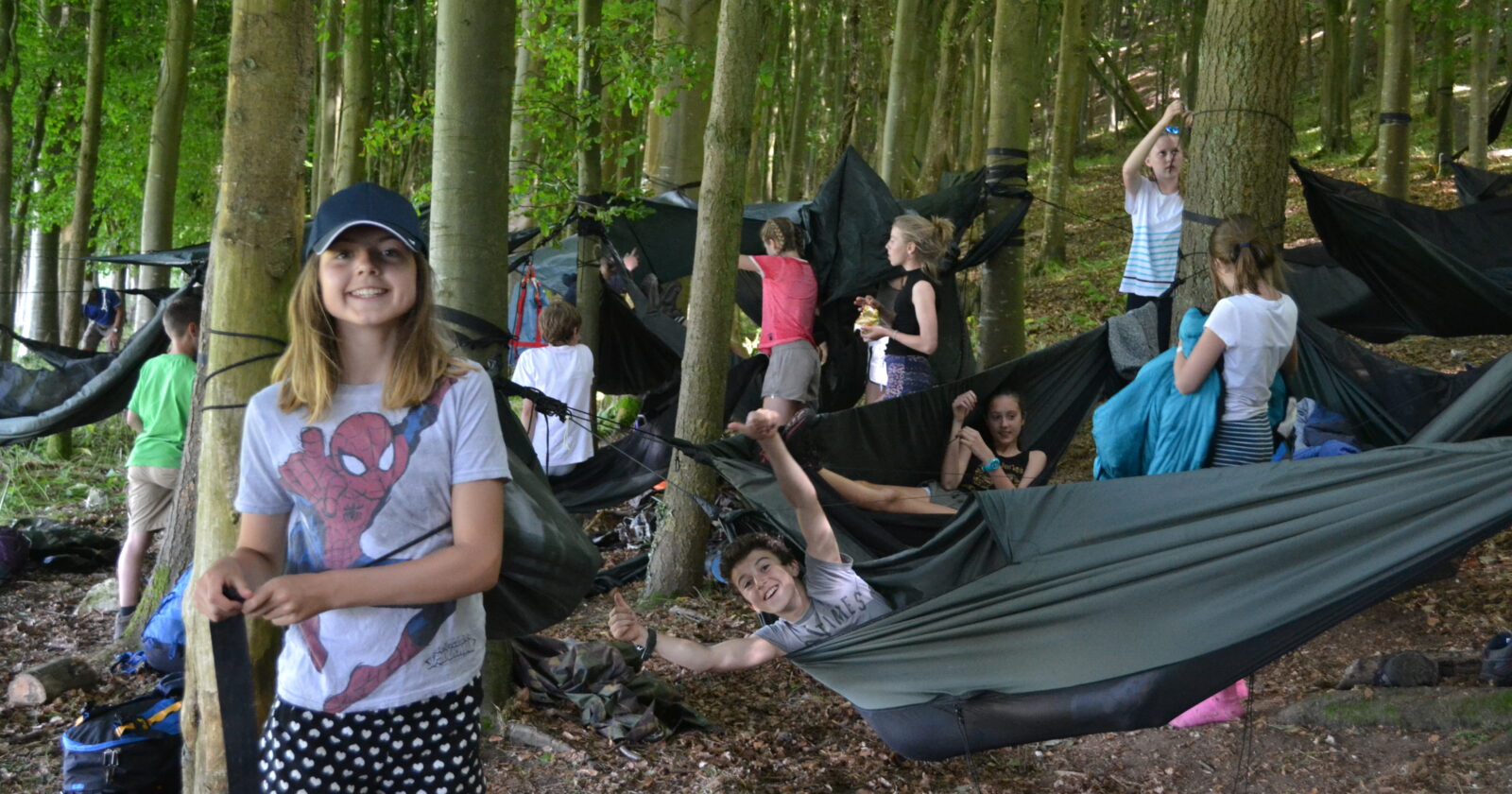 school group setting up camp in a bushcraft session