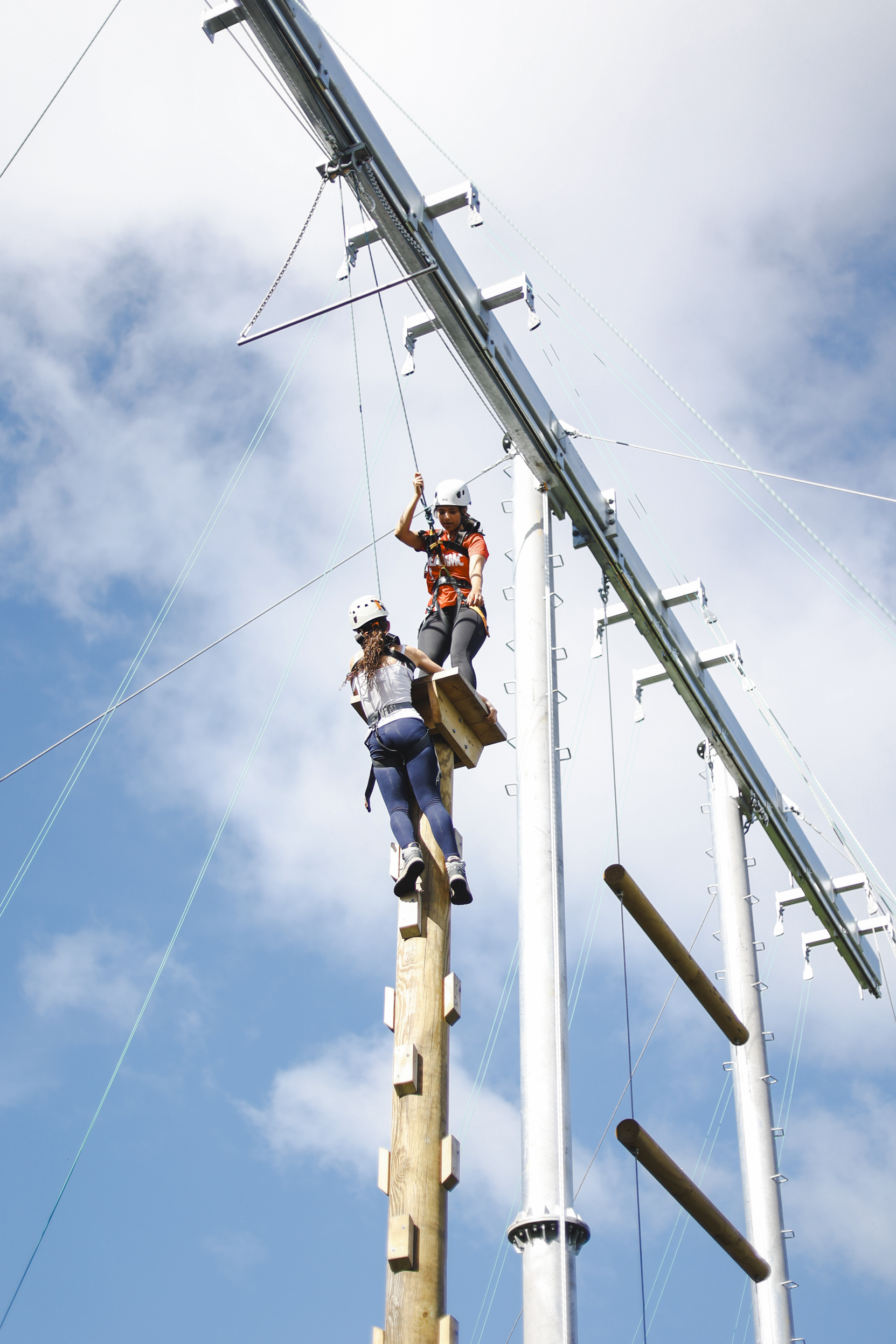 participants climbing high ropes course at Cumulus Outdoors Residential Centre in Swanage