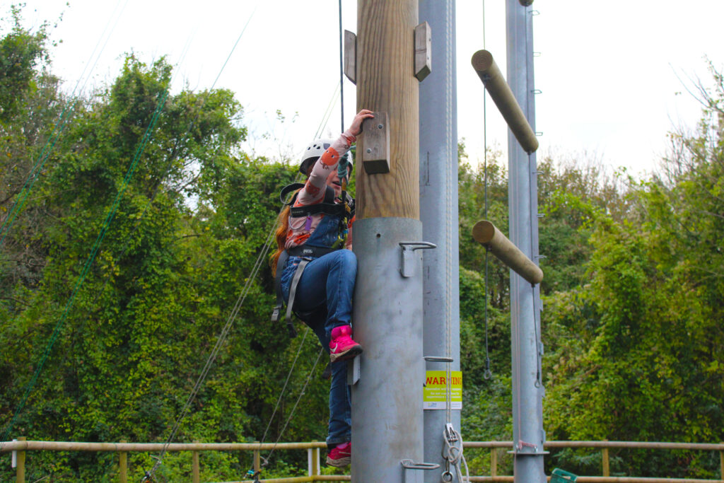 Purbeck Goes Wild participant climbing high ropes course